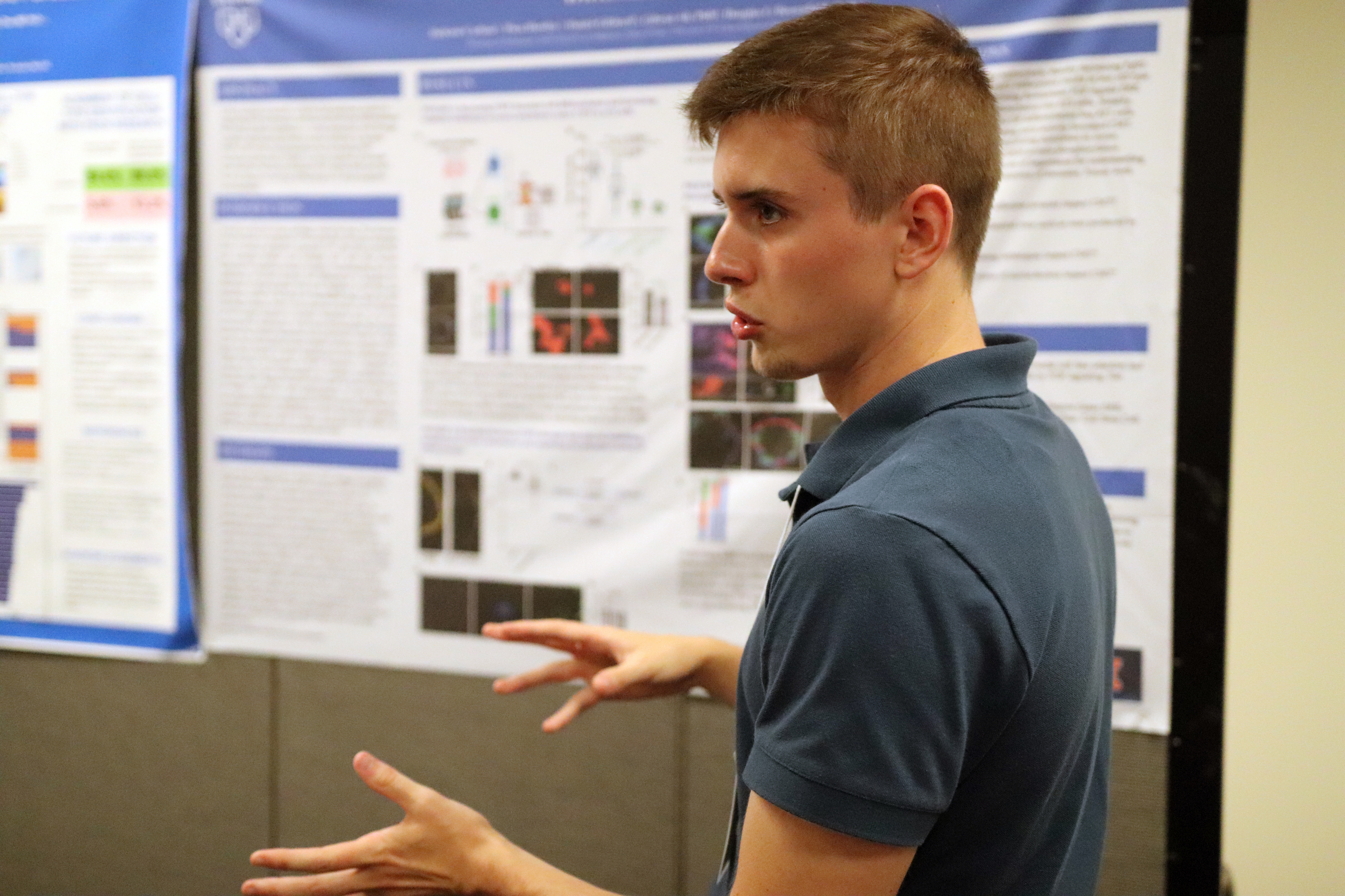 2024 Summer Undergraduate Research Fellow Matt Beard presents during the Illinois poster session