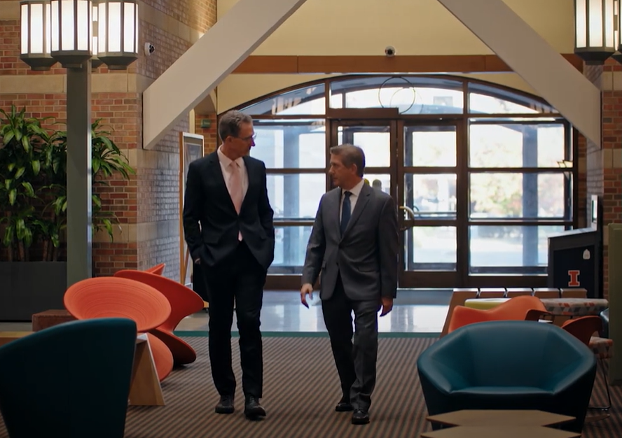 Boppart and McGee talk as they walk through the Beckman Atrium