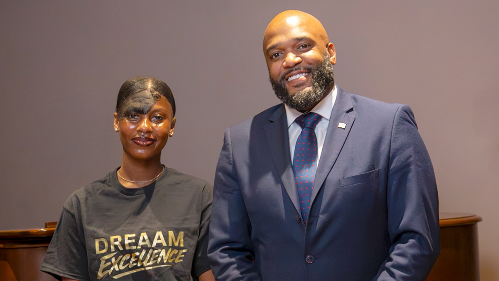 teenage girl and middle-aged man pose