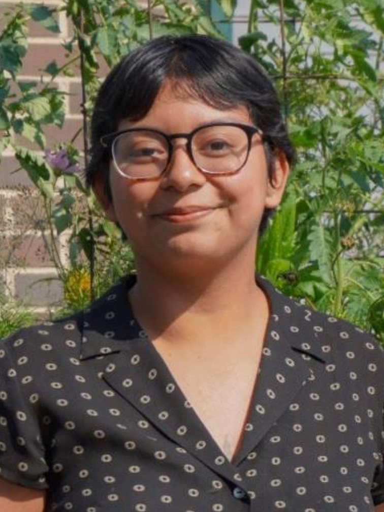 Kiera Balleza standing in a garden setting