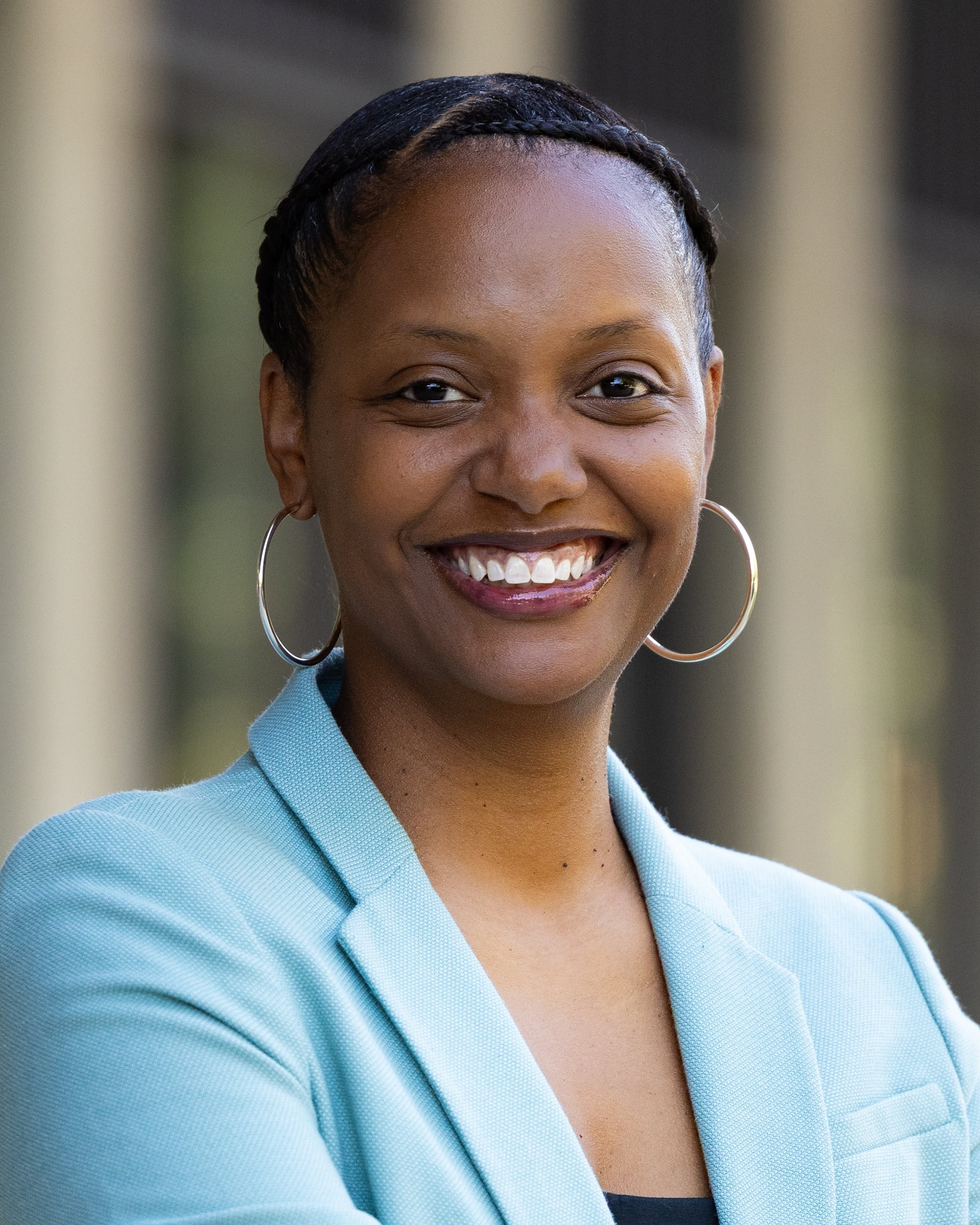 Professor Cherie Avent standing in front of the College of Education
