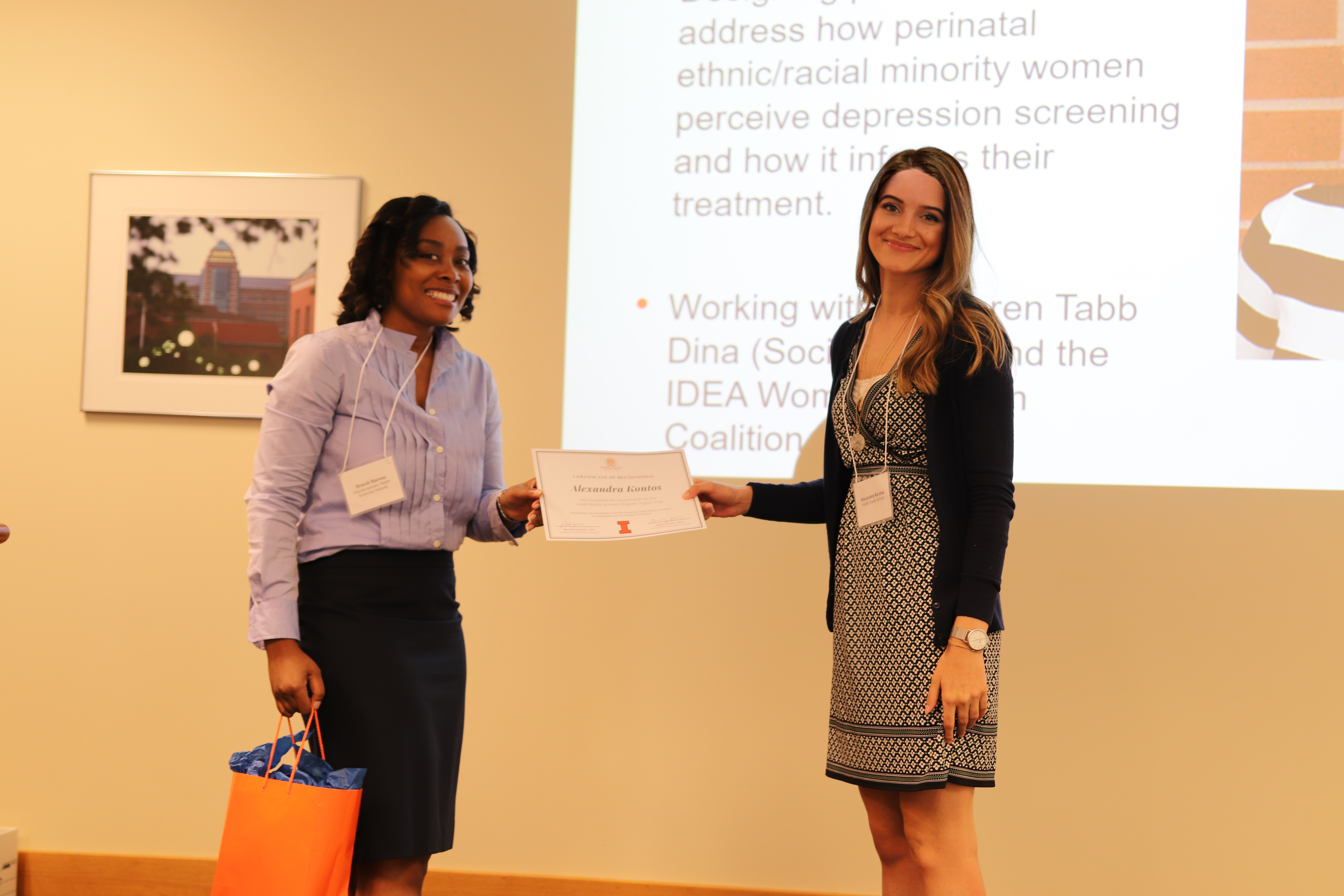 Alex receiving her certificate from Health Equity Scholars program manager Brandi Barnes