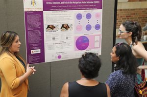 Allie Kormos presents her poster at the 2023 Community-Academic Scholars Poster Session