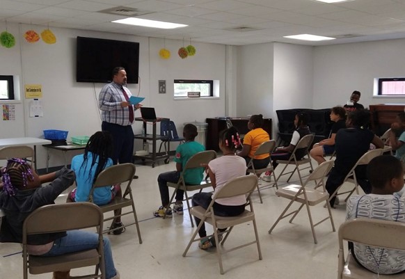 Danville Mayor Rickey Williams with Hope Center students during a community activity with Professor Kevin Tan&amp;rsquo;s team.