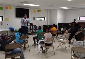 Danville Mayor Rickey Williams with Hope Center students during a community activity with Professor Kevin Tan&amp;rsquo;s team.
